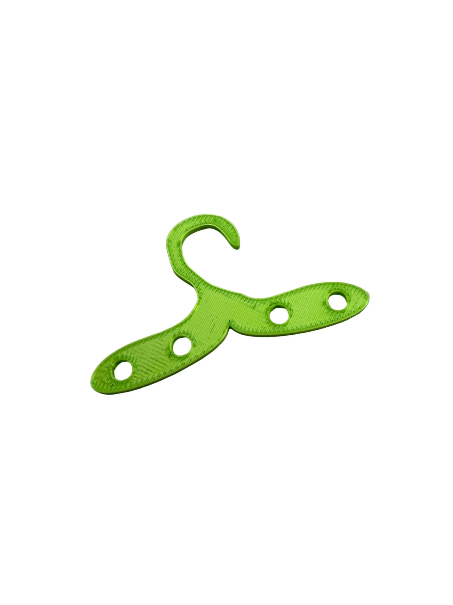 Green plastic hanger on a white background