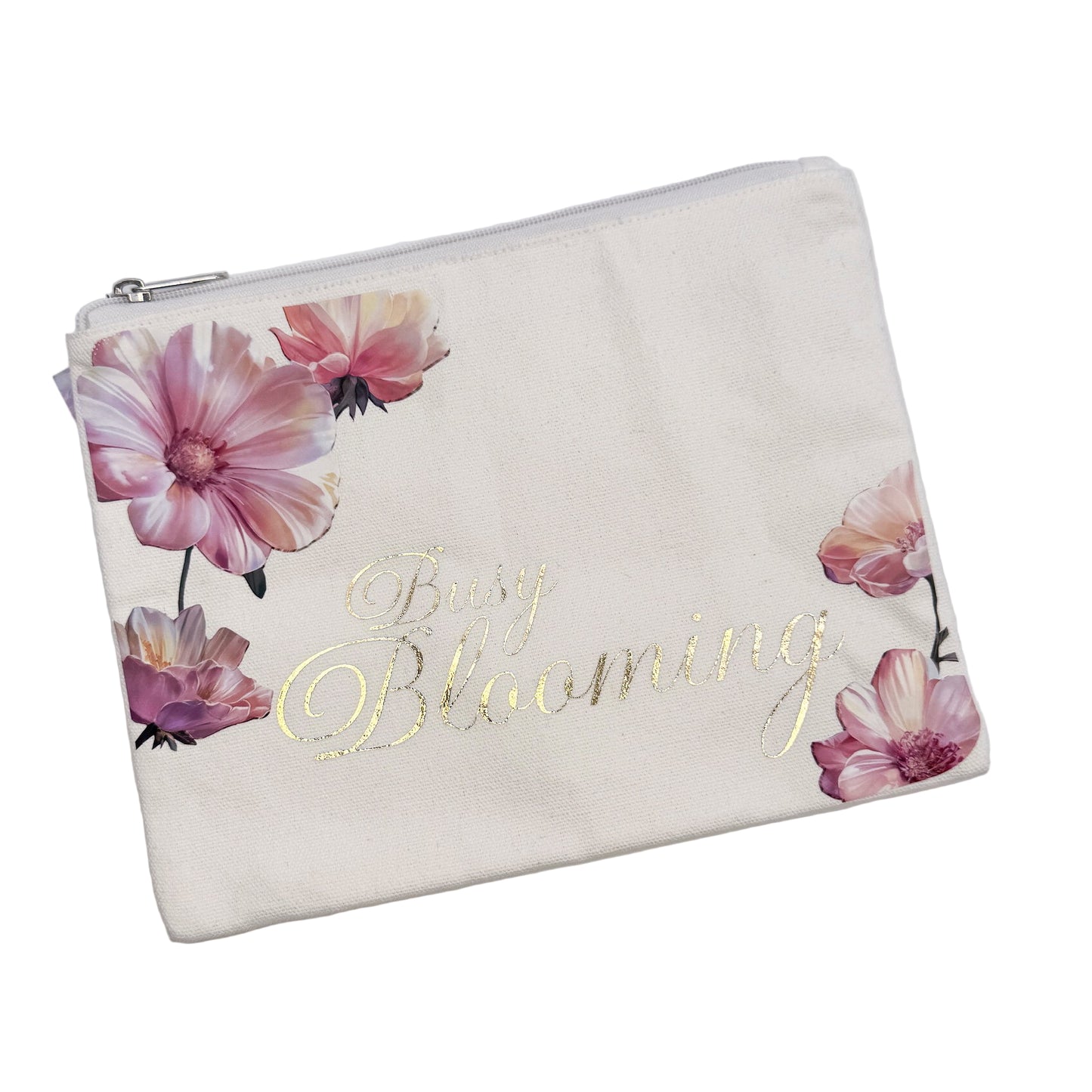 A large pouch with a floral pattern and the text 'Busy Blooming' printed on it.