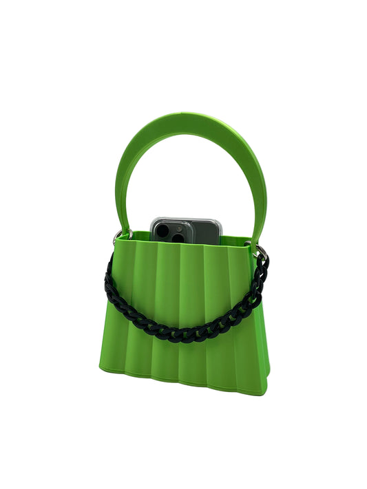 Green 3D printed purse with articulating handle and a black accent chain with a iPhone 5 pro max sticking slightly out of the top