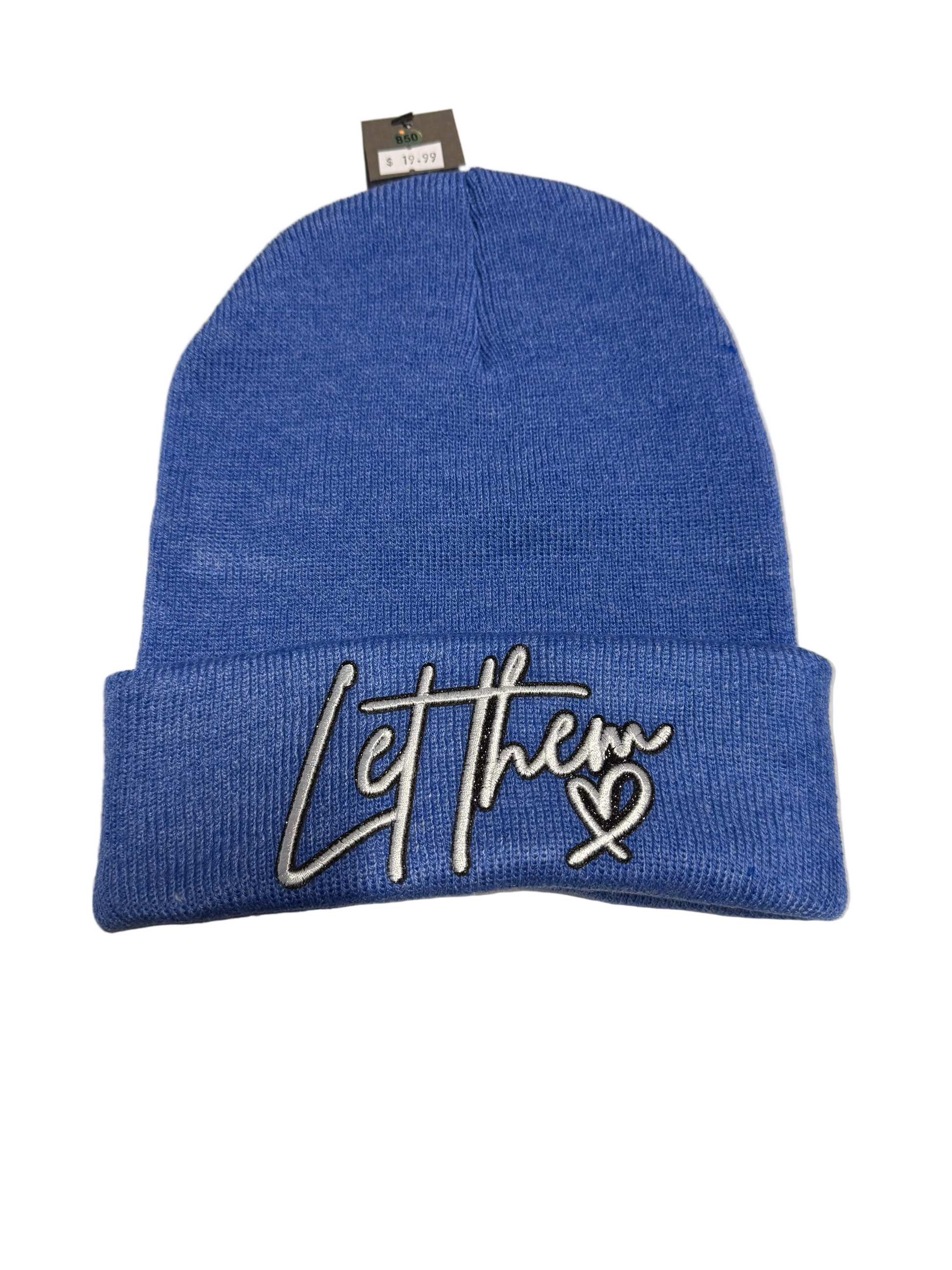 Blue beanie with 'Let them' text on a gray surface