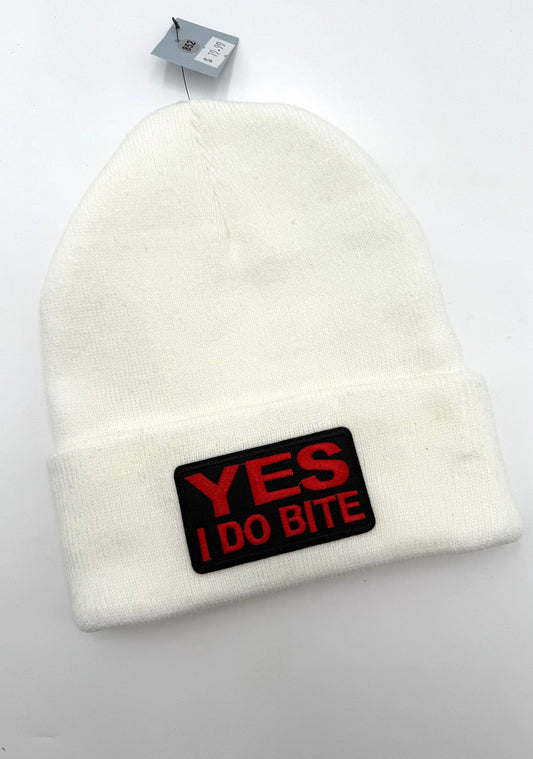 White beanie with a red and black patch on a white background